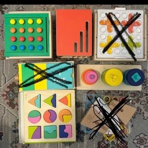 7 piece Lovevery lot- 4 brand new toys and 3 gently used books.